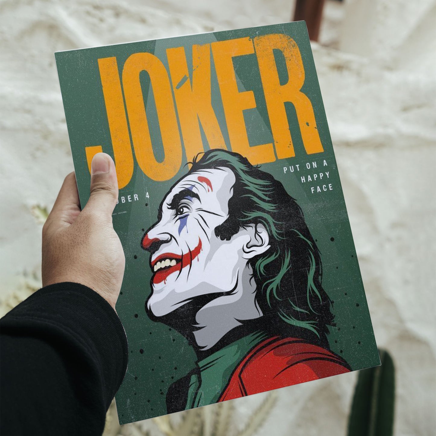 Joker Joaquin Phoenix illustrated movie poster size guide featuring 11.7 by 16.5 inch dimensions with blue arrows.