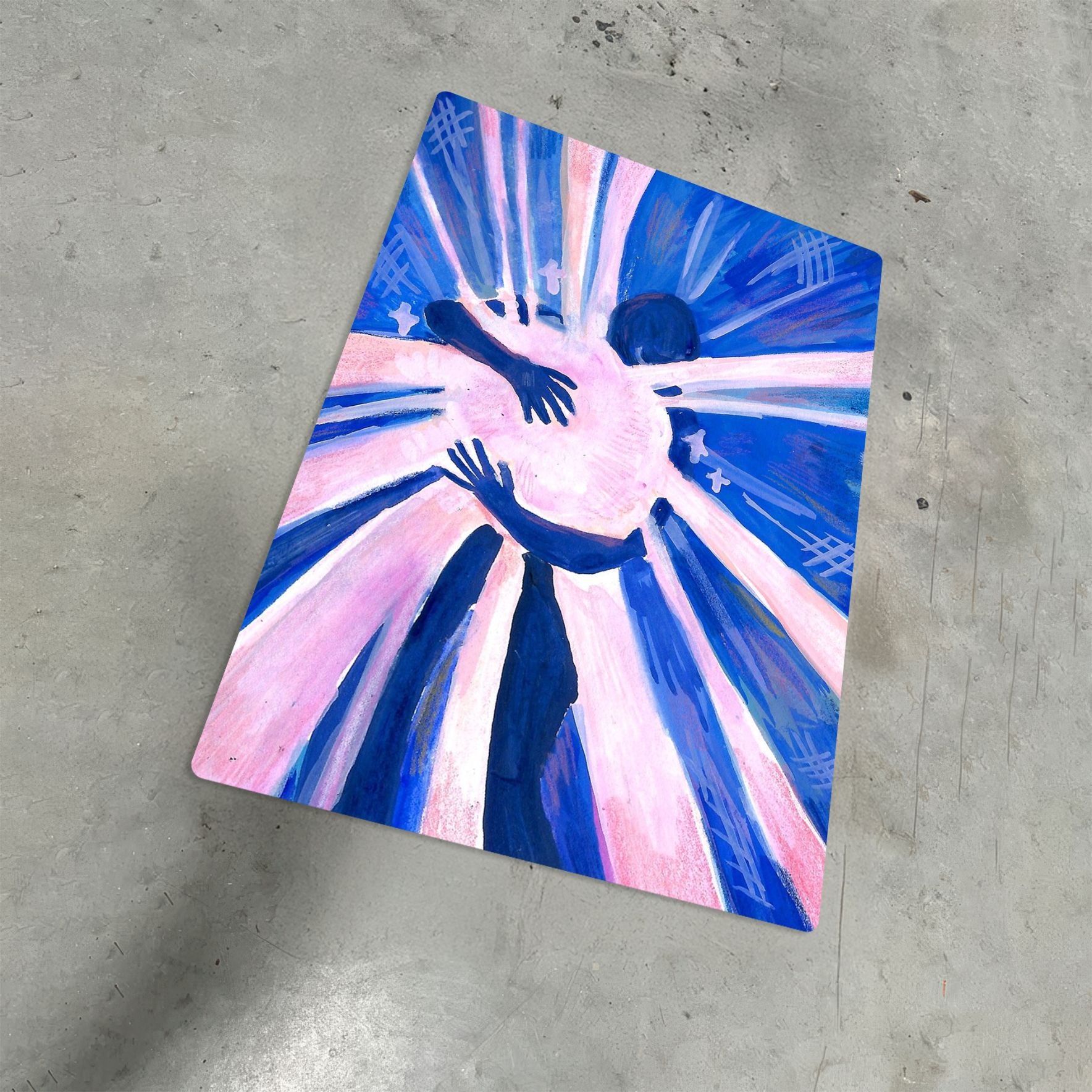 Abstract hug illustration on a metal poster featuring blue and pink tones on a concrete floor.