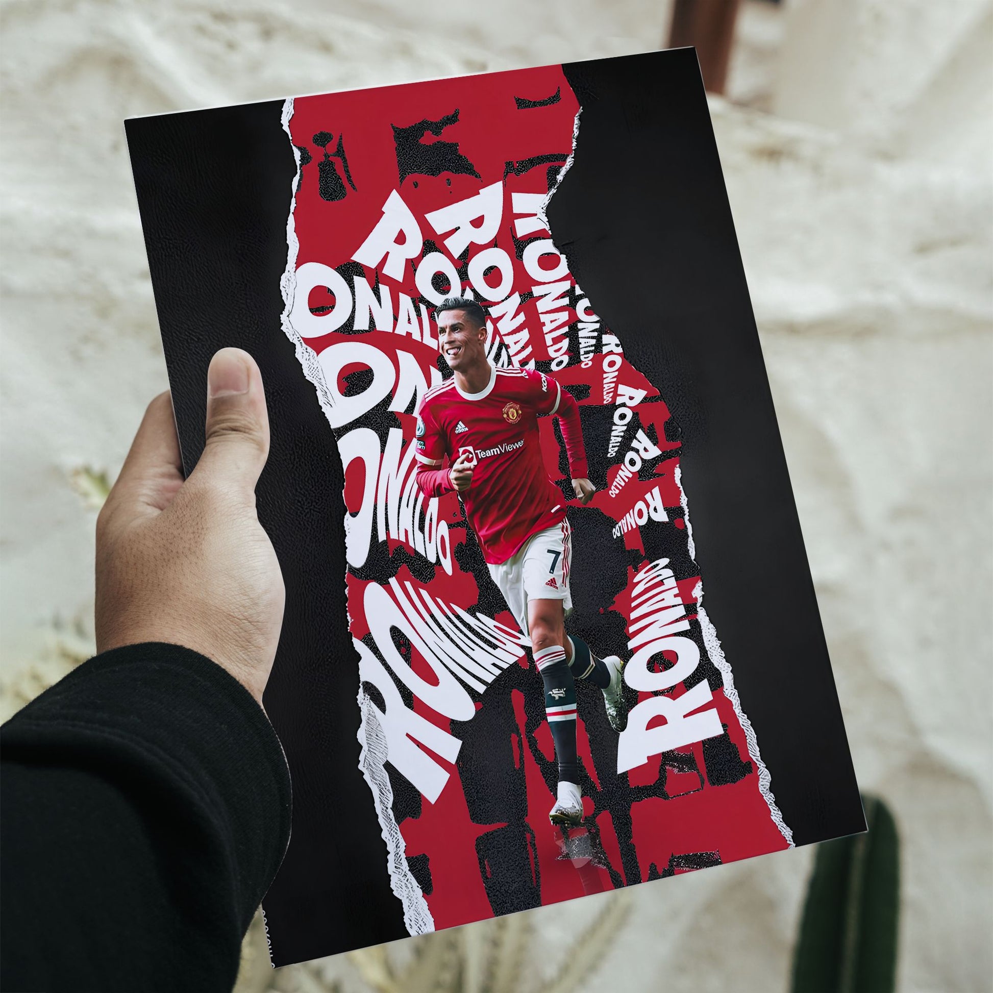 Cristiano Ronaldo Manchester United torn typography poster featuring career highlights and action shots with dimensions of 16.5 by 11.7 inches.