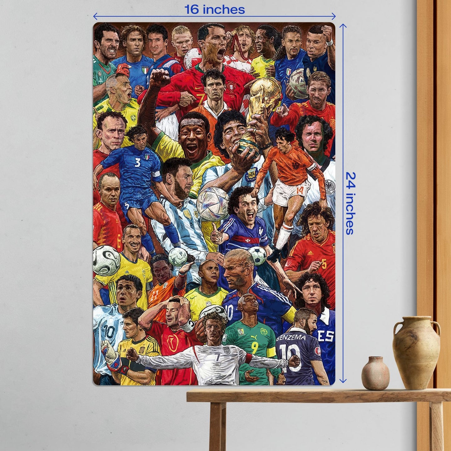 Large size Football Legends World Cup Collage metal poster measuring 16 inches by 24 inches displayed on a white wall above a wooden table.