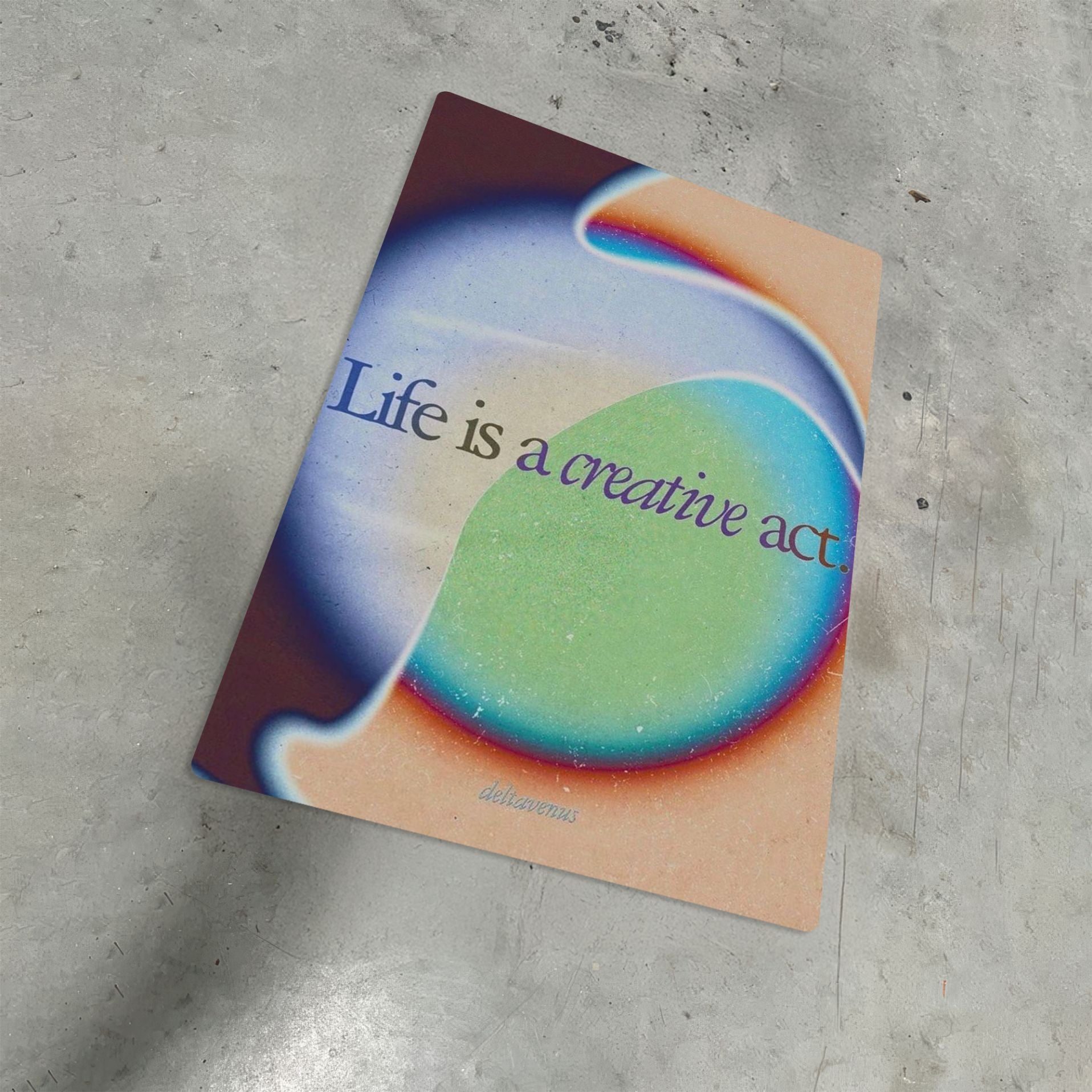 Gradient aura aesthetic metal poster with the quote Life is a creative act shown on a gray concrete background.