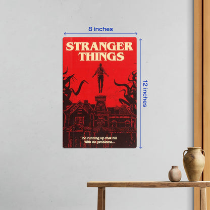 Small 8x12 inch Stranger Things Max Mayfield metal poster hanging on a clean white wall in a minimalist room setting.