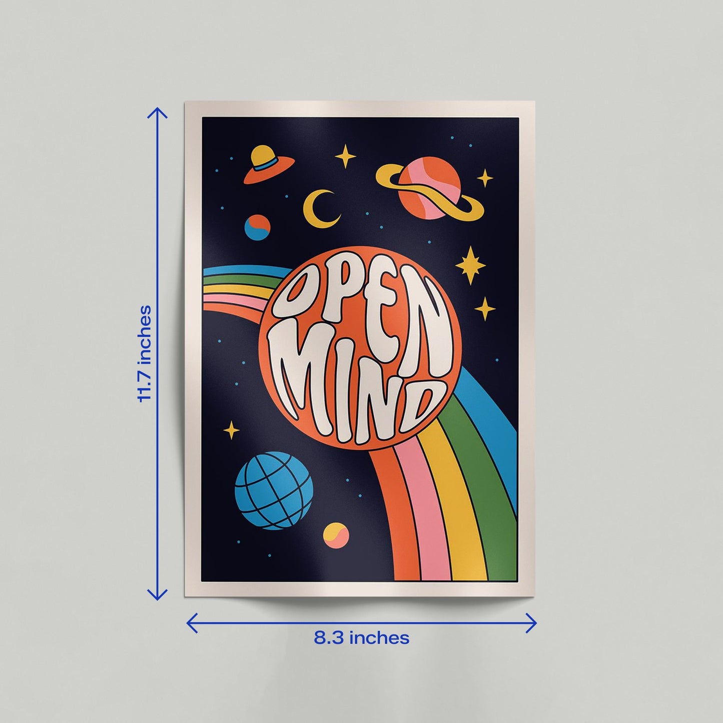 A vertical retro space art poster with "Open Mind" typography leaning against a wall in a modern room setting.