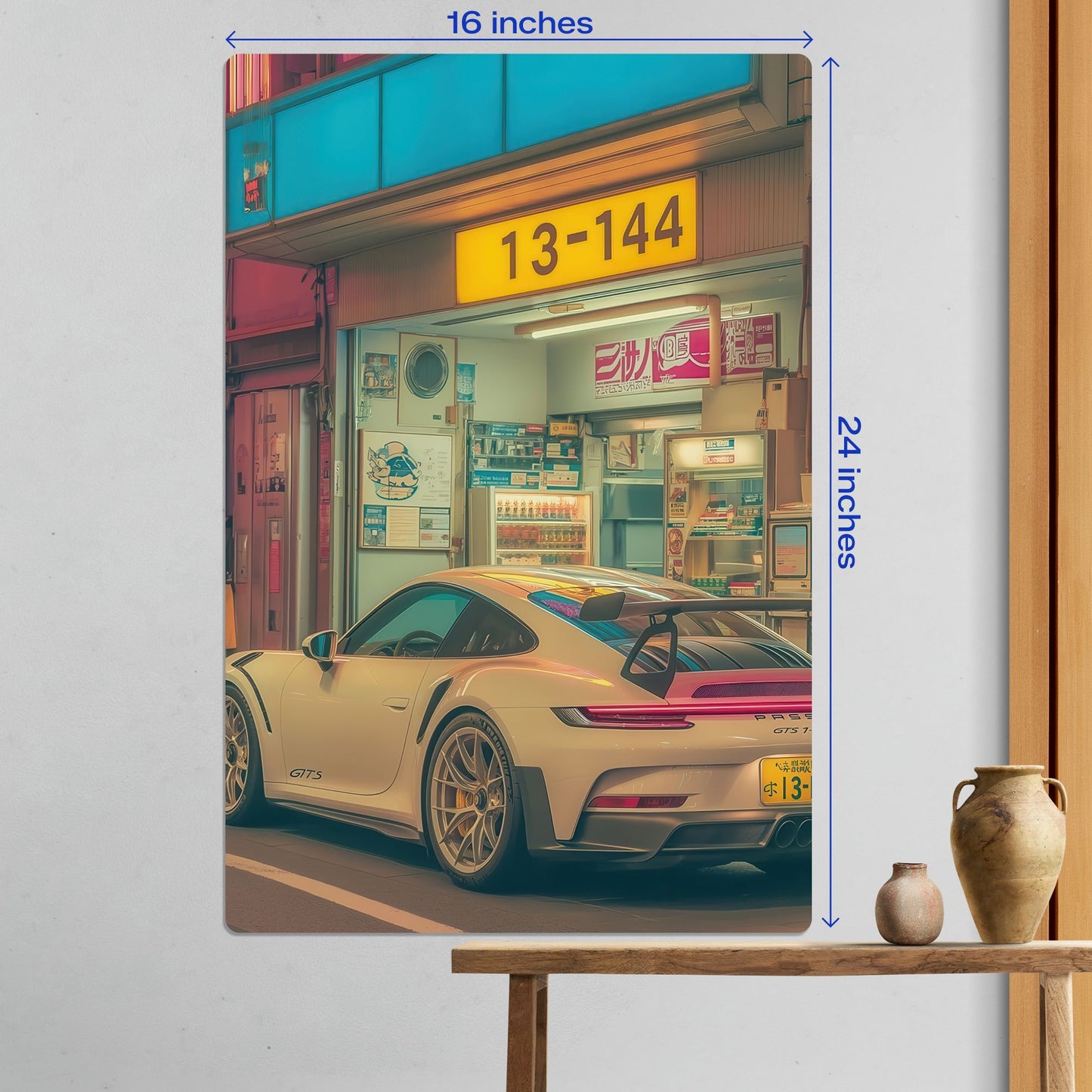 Large 16 by 24 inch Porsche 911 GT3 RS JDM style metal poster displayed on a white wall in a modern room.