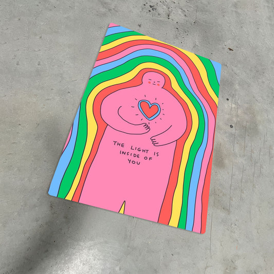 Rainbow Heart Inner Light minimalist metal poster lying on a concrete floor showcasing the vibrant hand-drawn art.