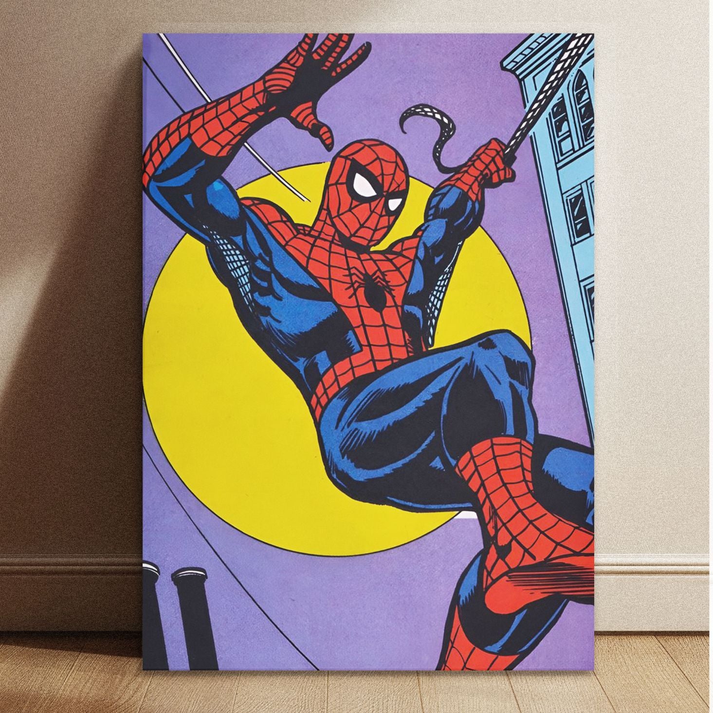 Spiderman Classic Comic Swing artwork printed on a stretched canvas, leaning against a wall on a wooden floor. A piece of retro superhero home decor and wall art.