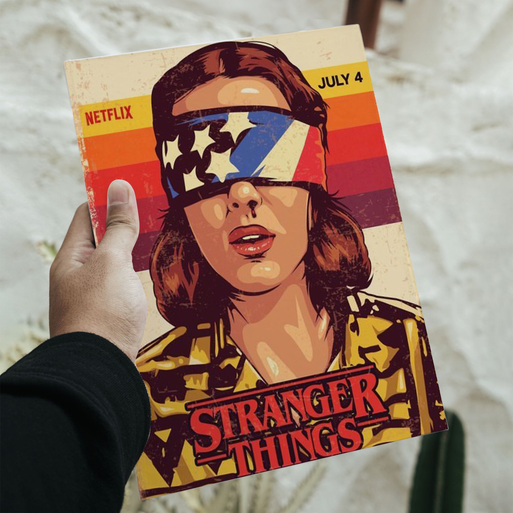 Vintage VHS style Stranger Things poster featuring Eleven wearing an American flag blindfold with dimensions 11.7 inches height by 8.3 inches width.
