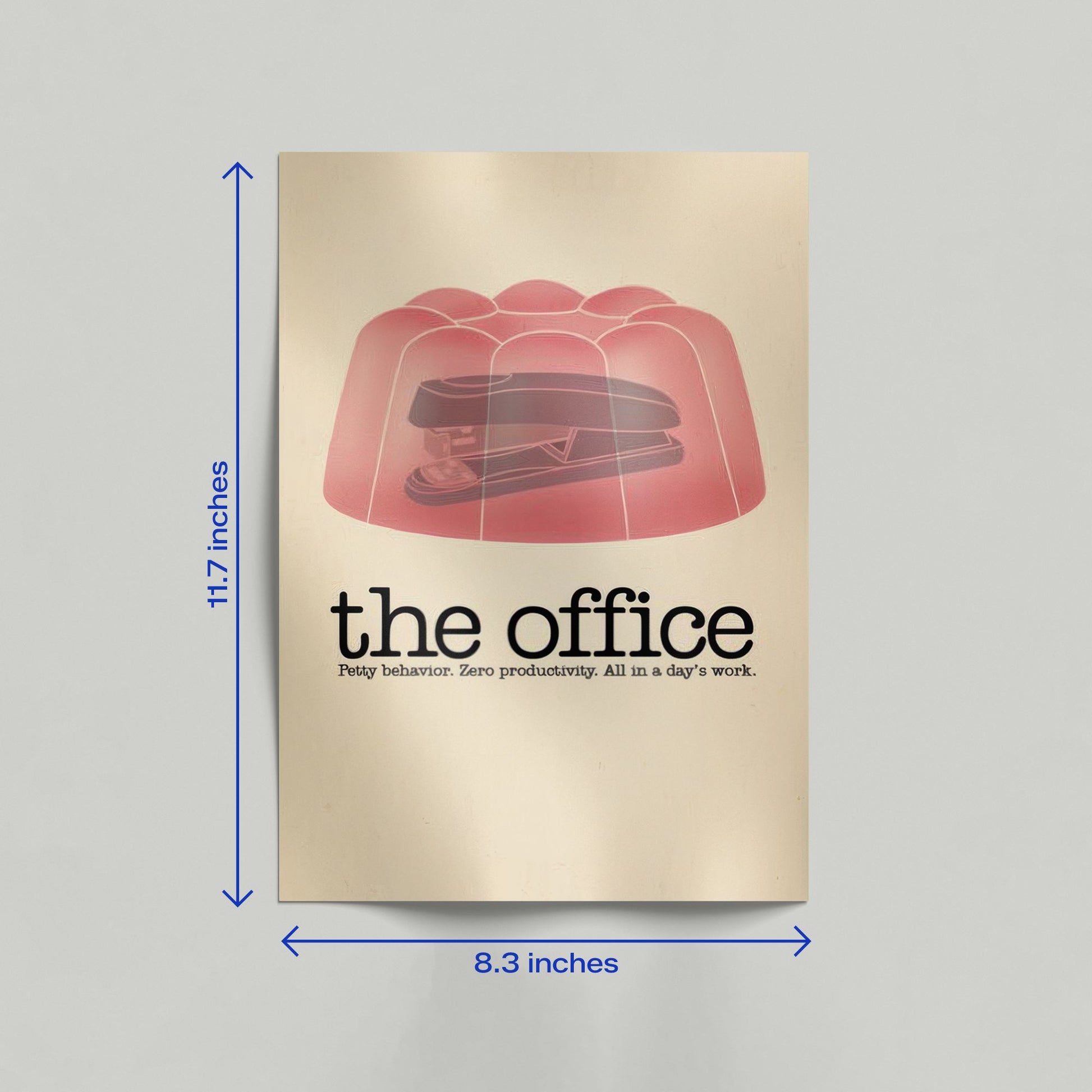 A framed-style minimalist poster of The Office stapler in jello prank leaning against a neutral-toned interior wall.